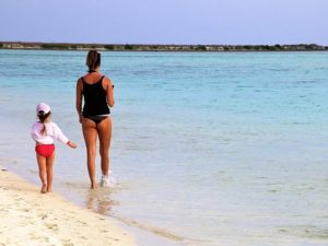 mom and daughter at the beach